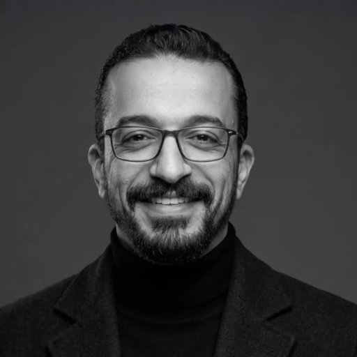 Hazem Khattab, Digital Marketing Expert, in a professional black and white portrait.
